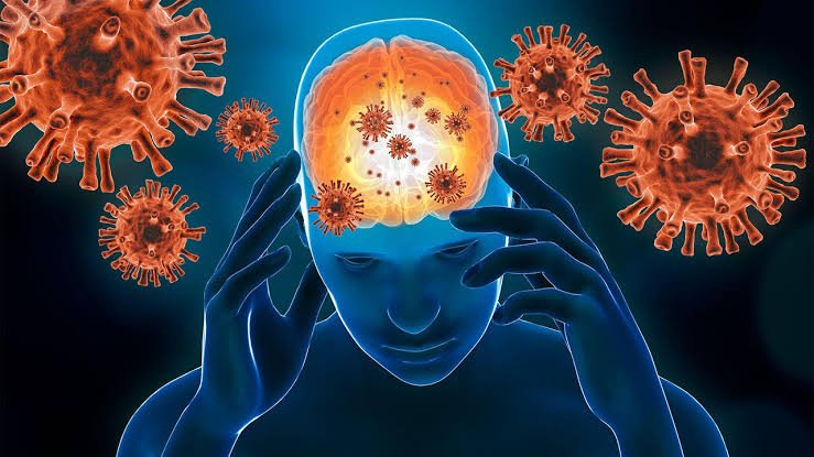Person holding their head with a glowing brain, representing stress and cognitive strain