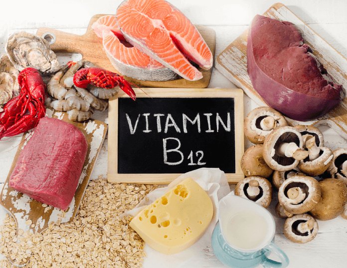 Foods rich in vitamin B12 arranged around a chalkboard labeled Vitamin B12