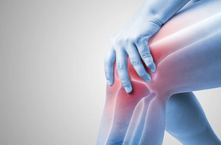 Anatomical illustration of a knee joint with red glow indicating discomfort