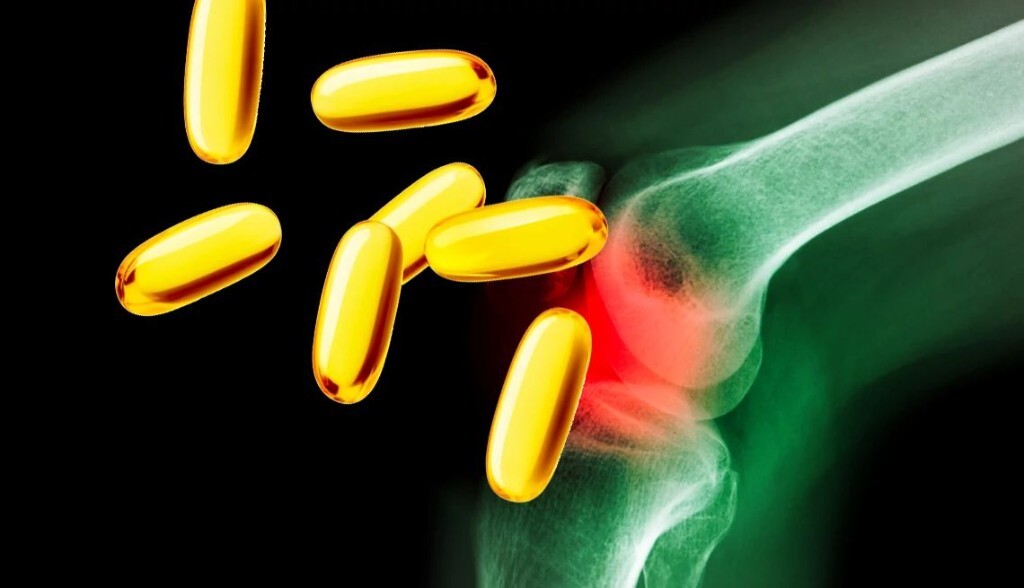 X-ray style knee joint with yellow softgel capsules suggesting nutritional support