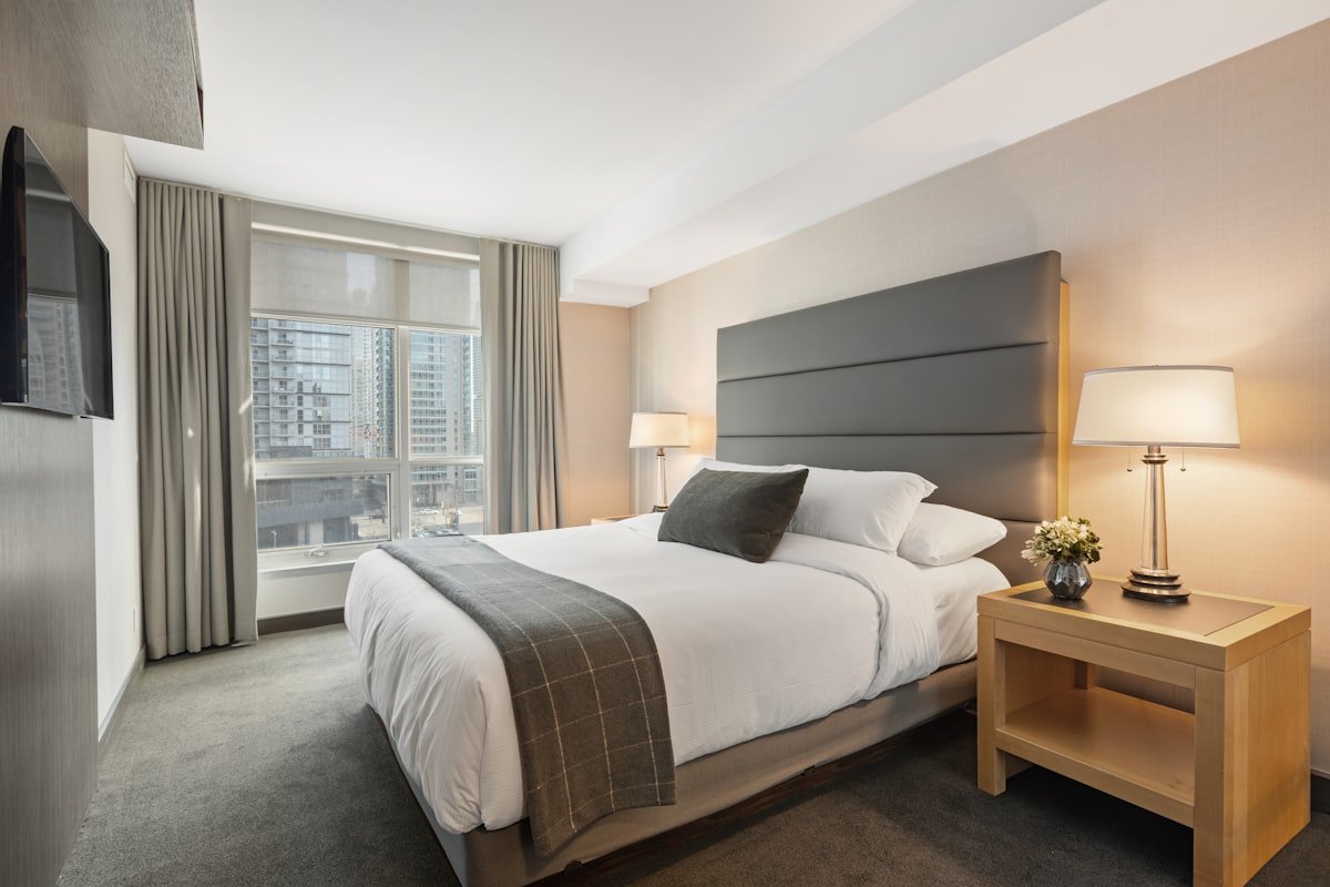 Bed and bedroom at night, representing disrupted sleep from nighttime urination