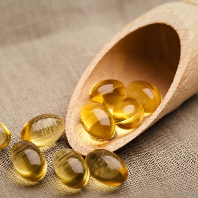 Golden softgel capsules representing nutritional support for men’s prostate wellness