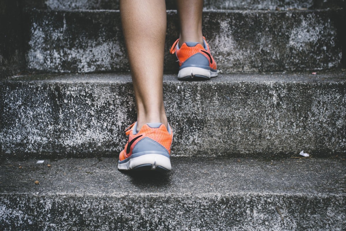 Person walking outdoors for daytime physical activity